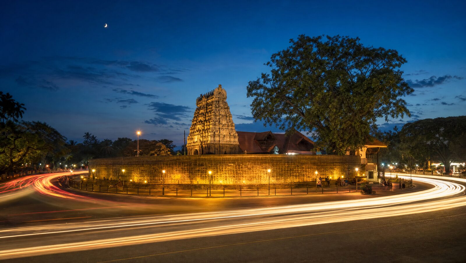 The Swaraj Round in Thrissur at blue hour with the temple gopuram lit
